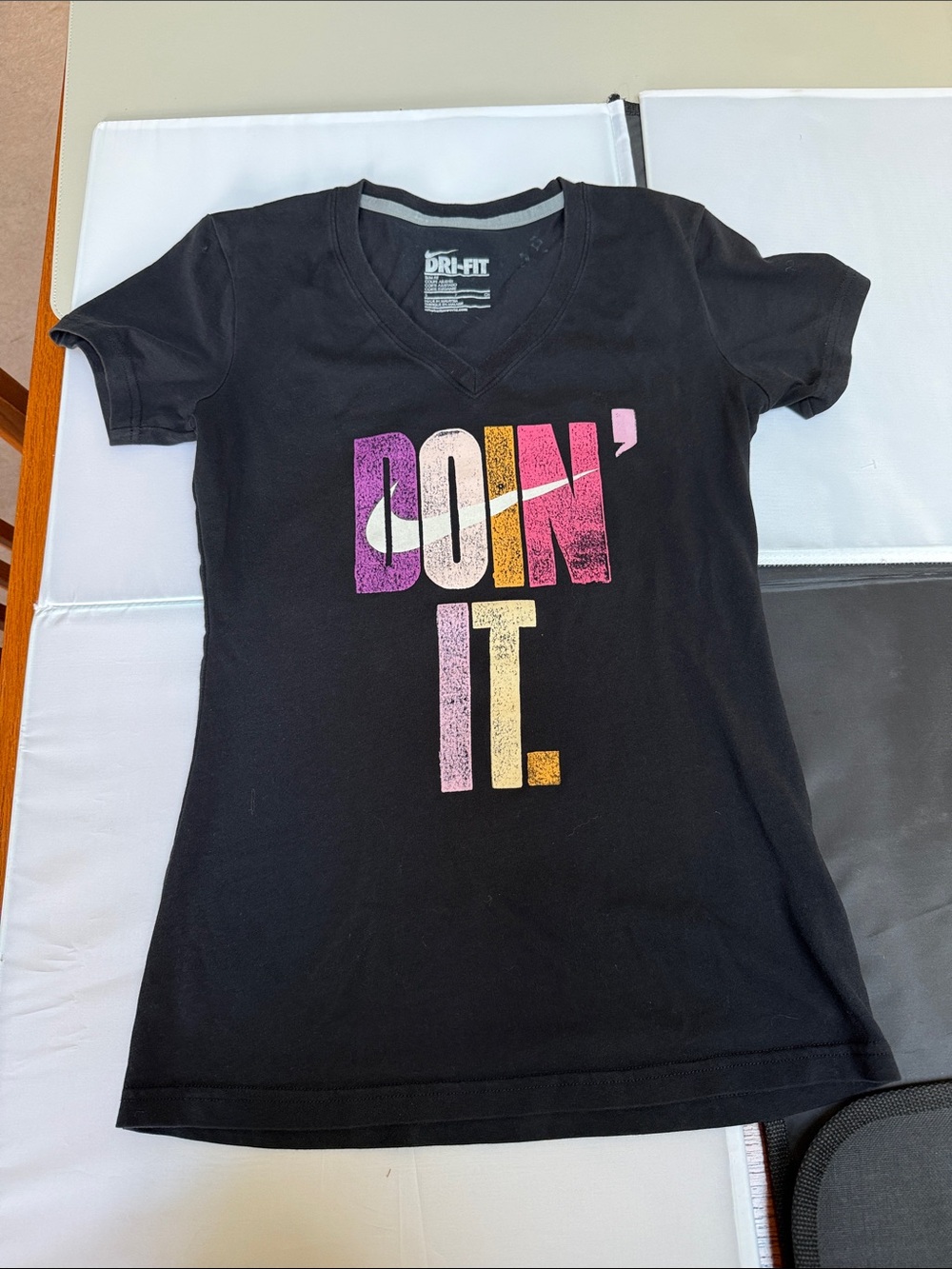 Nike Black V-Neck Women's Tee with Pink, Purple & Yellow Graphic